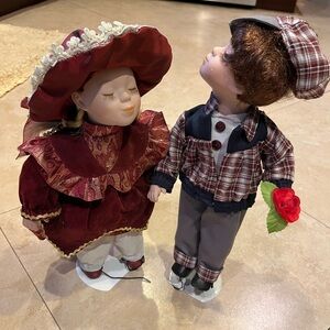 Adorable vintage porcelain dolls in love